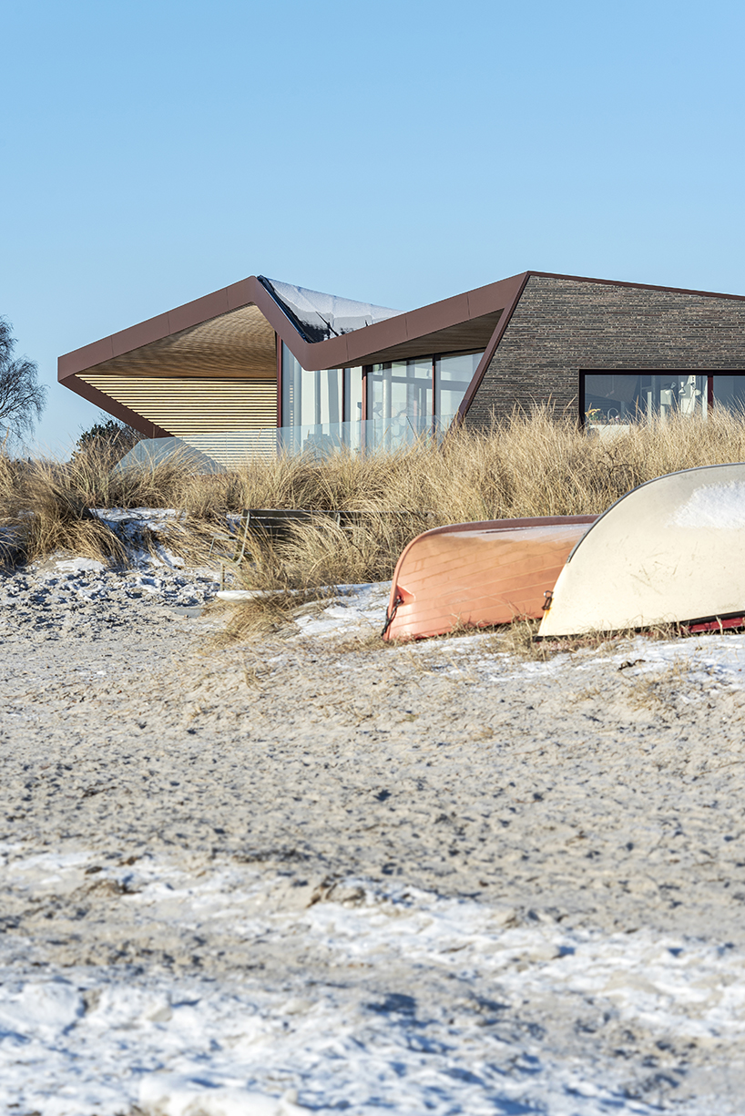 cebra completes danish seaside villa with sculptural roof 6