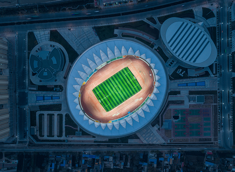 DUTS design completes oval olympic sports center stadium in linxia city, china