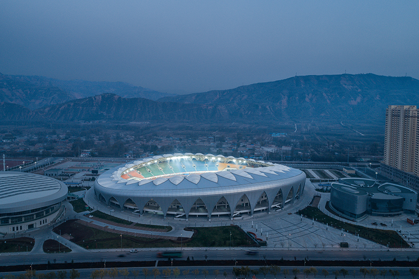 DUTS design completes oval olympic sports center stadium in linxia city, china