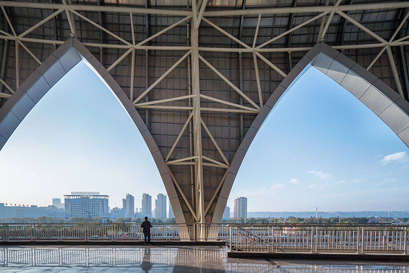 DUTS design completes oval olympic sports center stadium in linxia city, china