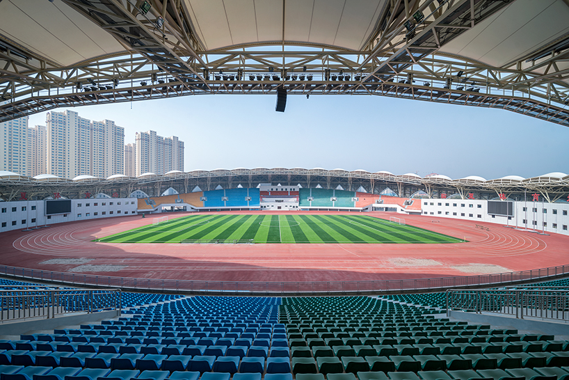 DUTS design completes oval olympic sports center stadium in linxia city, china