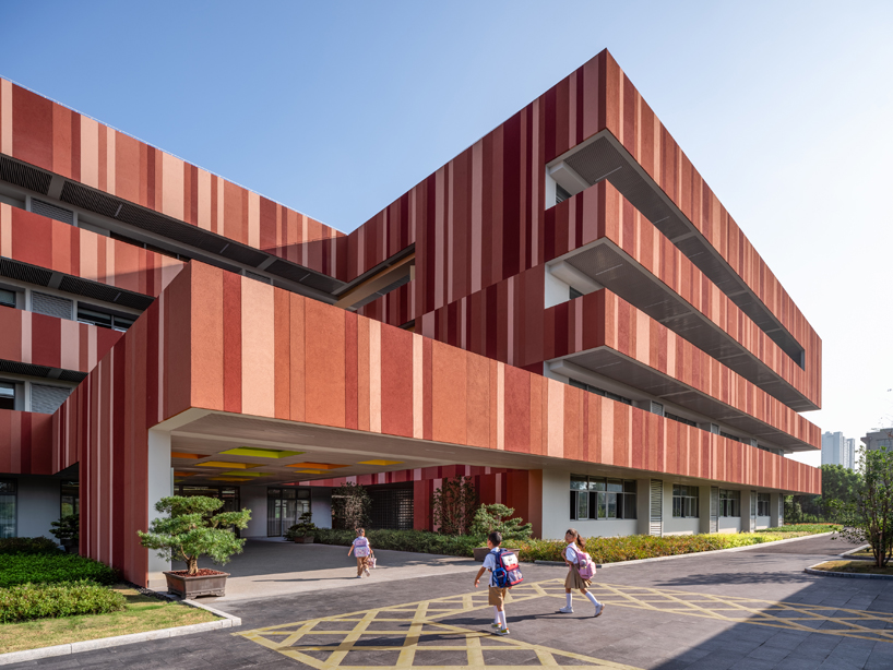 bright red striped patterns overlay fengpu elementary school's exterior in shanghai - 3