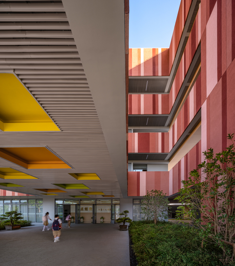 bright red striped patterns overlay fengpu elementary school's exterior in shanghai - 5