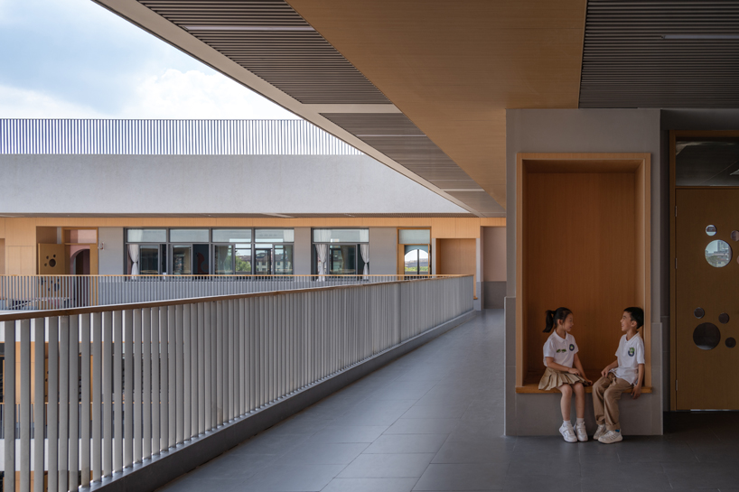 bright red striped patterns overlay fengpu elementary school's exterior in shanghai - 9