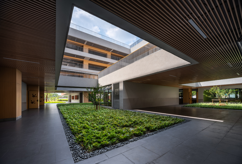bright red striped patterns overlay fengpu elementary school's exterior in shanghai - 8