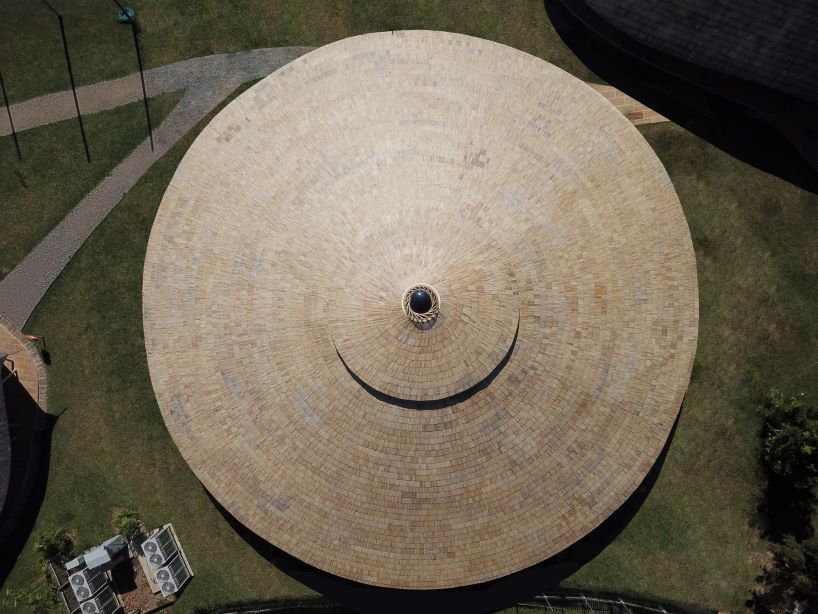 chiangmai life architects builds concentric bamboo school library with oculus in thailand