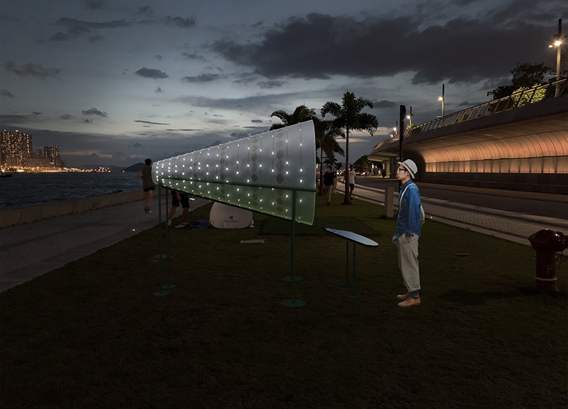 studio etain ho designs 'cone of radiance' light installation to brings joy & comfort to hong kong