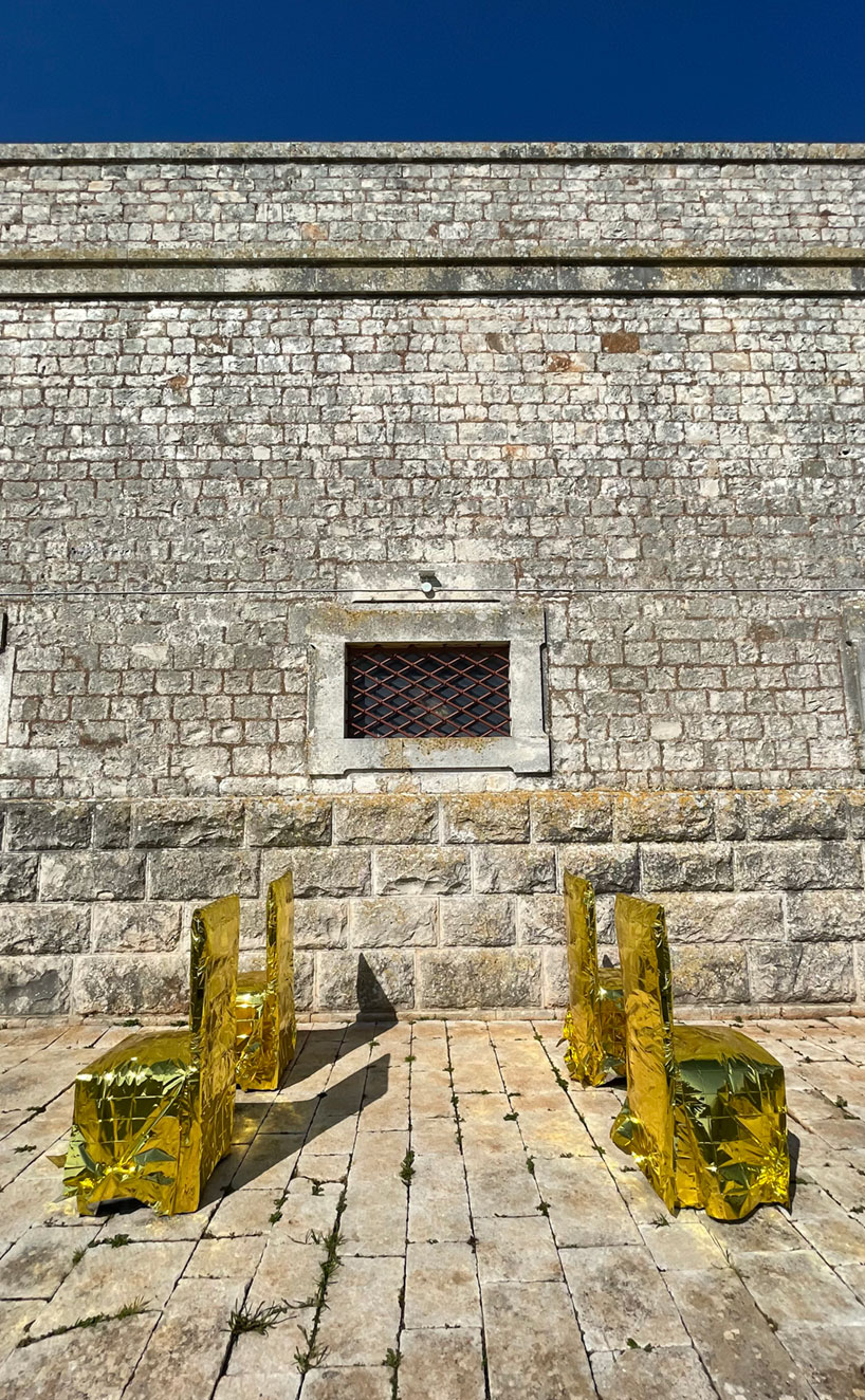 studio lievito wraps chairs in isothermal blankets for art installation in apulia