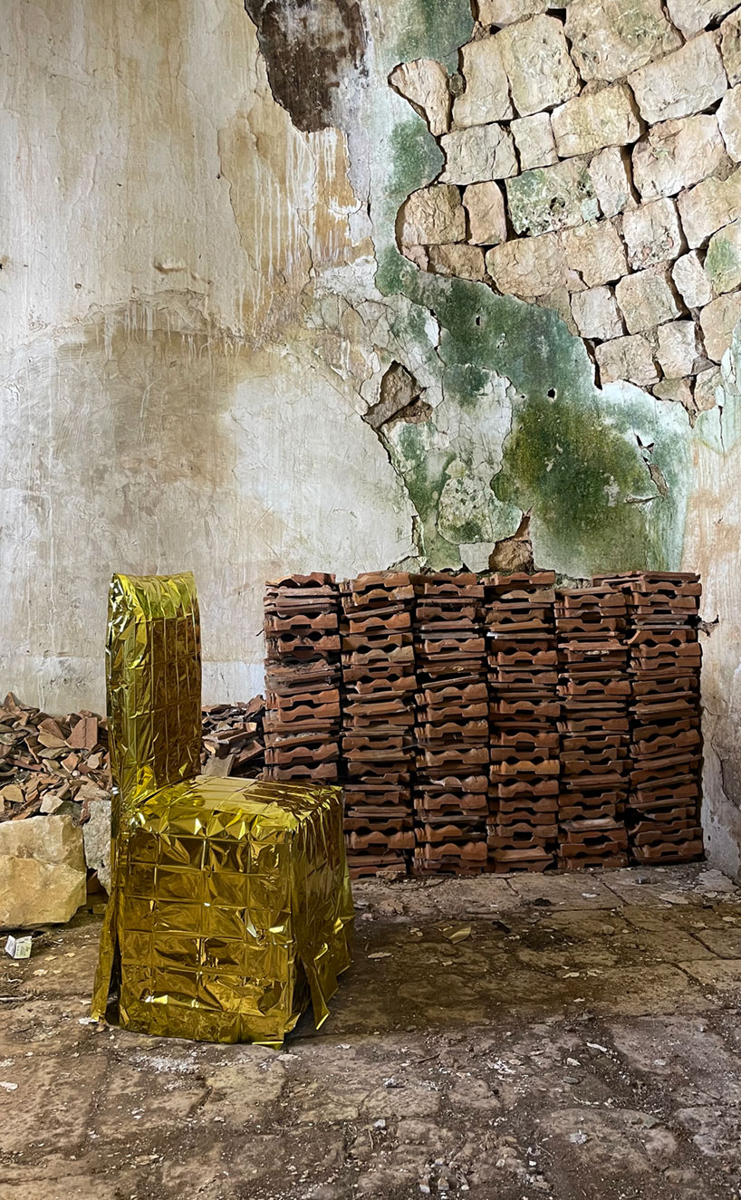 studio lievito wraps chairs in isothermal blankets for art installation in apulia
