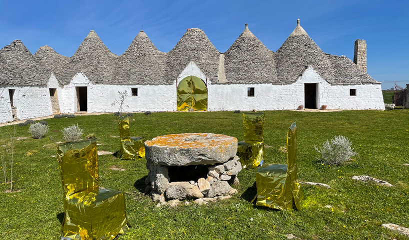 studio lievito wraps chairs in isothermal blankets for art installation in apulia