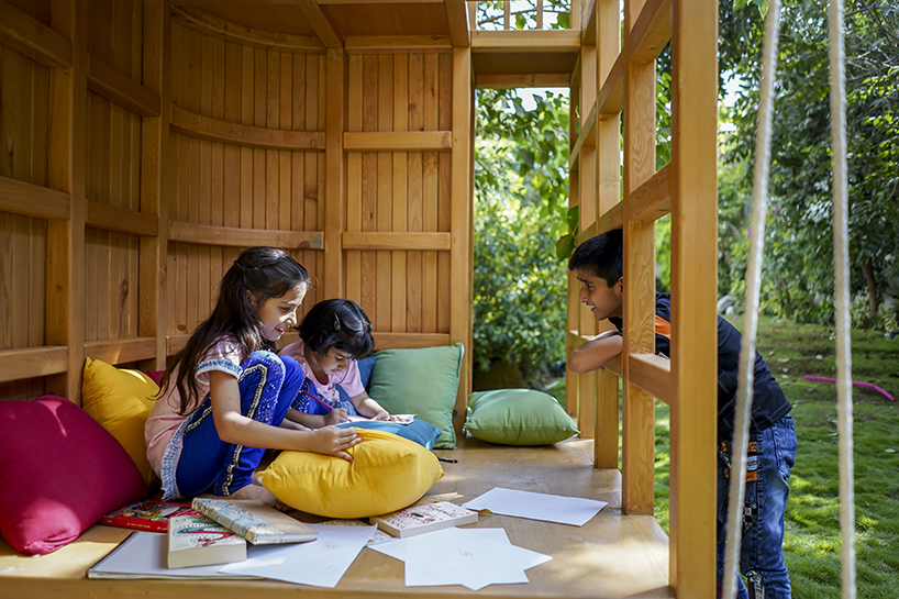 open door design studio nestles wooden experience for kids in a private garden in pakistan