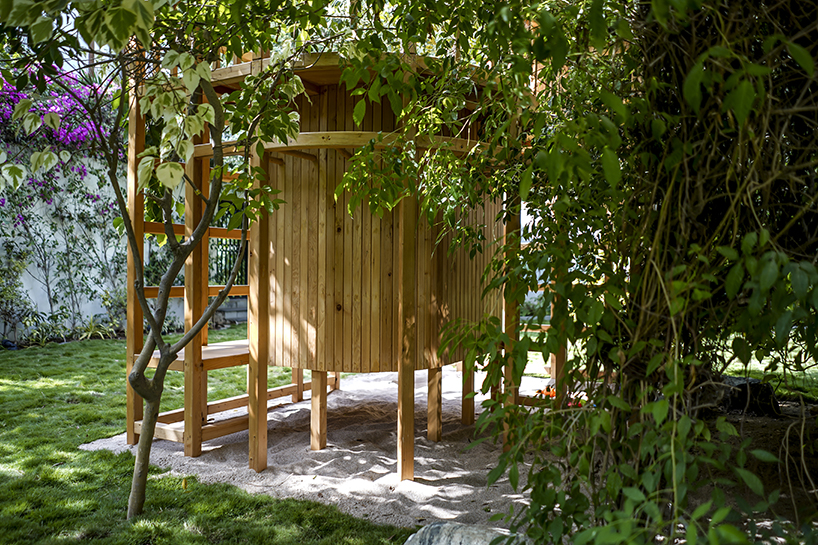 open door design studio nestles wooden experience for kids in a private garden in pakistan