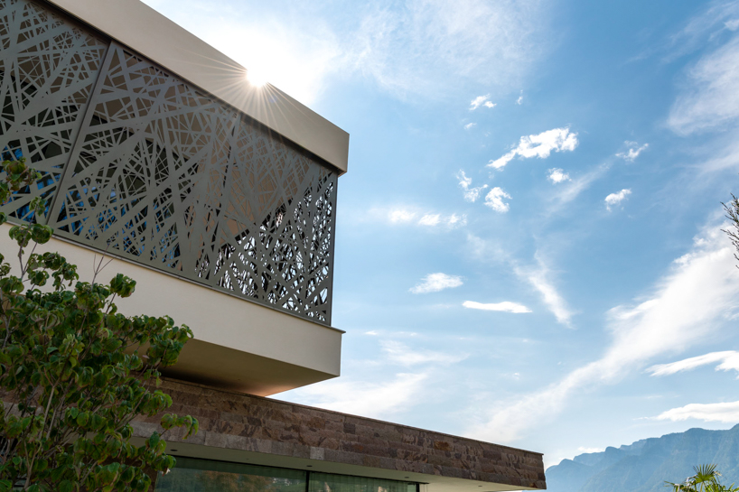 interwoven bronze façade adorns dwelling by monovolume architecture+design, italy