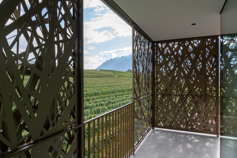 interwoven bronze façade adorns dwelling by monovolume architecture+design, italy