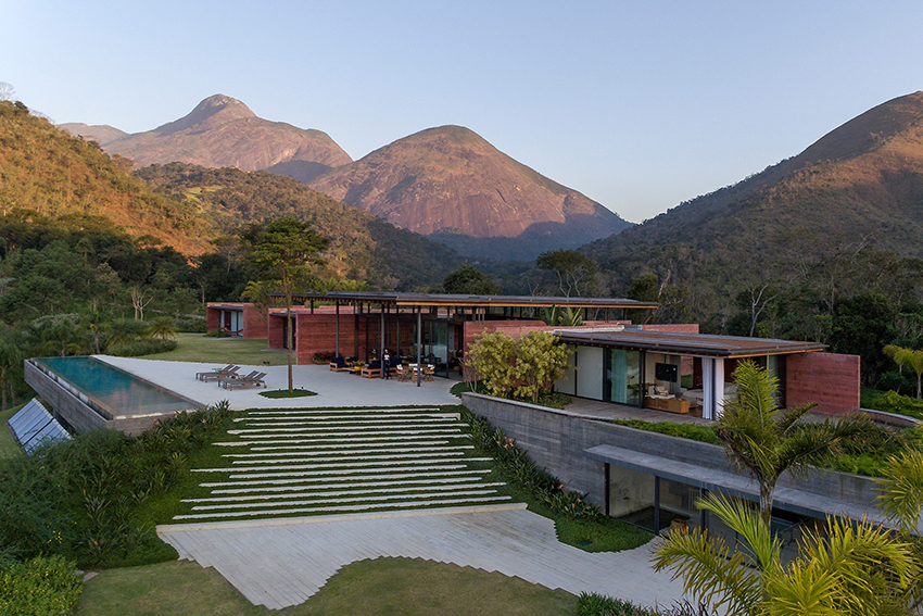 terracotta tinted walls adorn this hilltop weekend home in brazil by bernardes arquitetura 