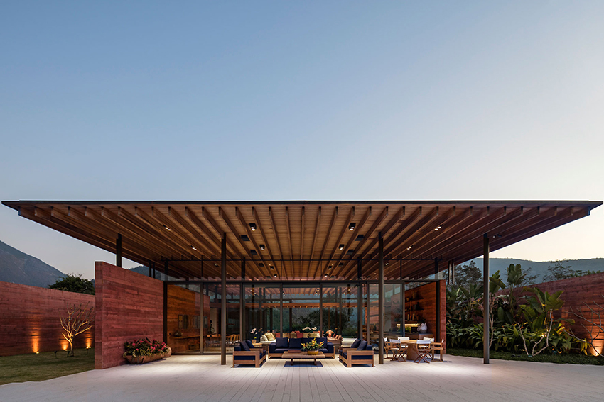 terracotta tinted walls adorn this hilltop weekend home in brazil by bernardes arquitetura 