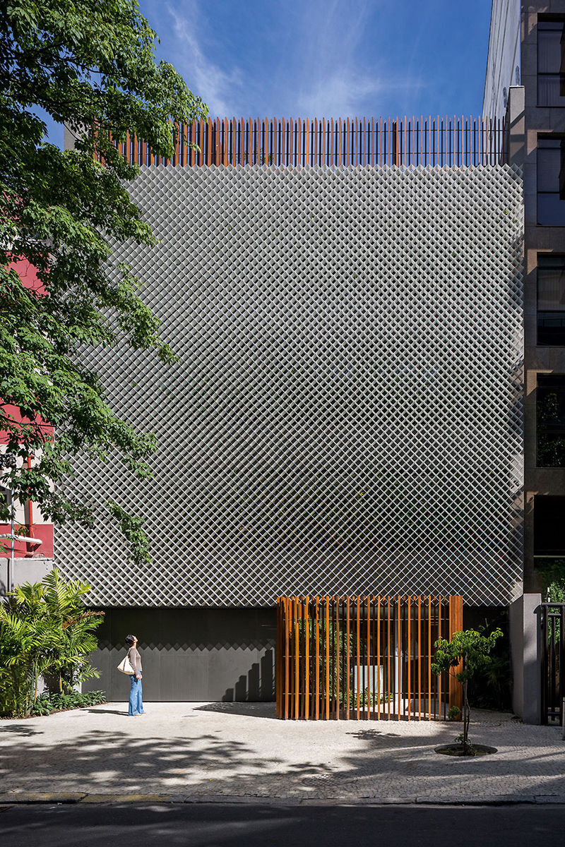perforated metal façade decorates bernardes arquitetura's office block in brazil