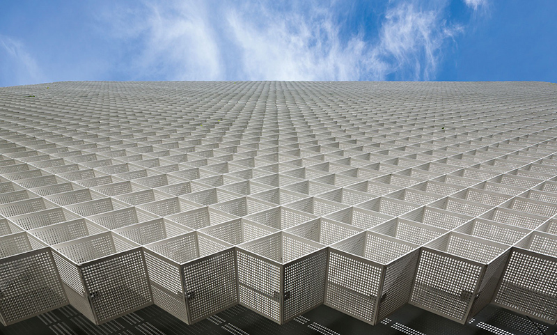 perforated metal façade decorates bernardes arquitetura's office block in brazil