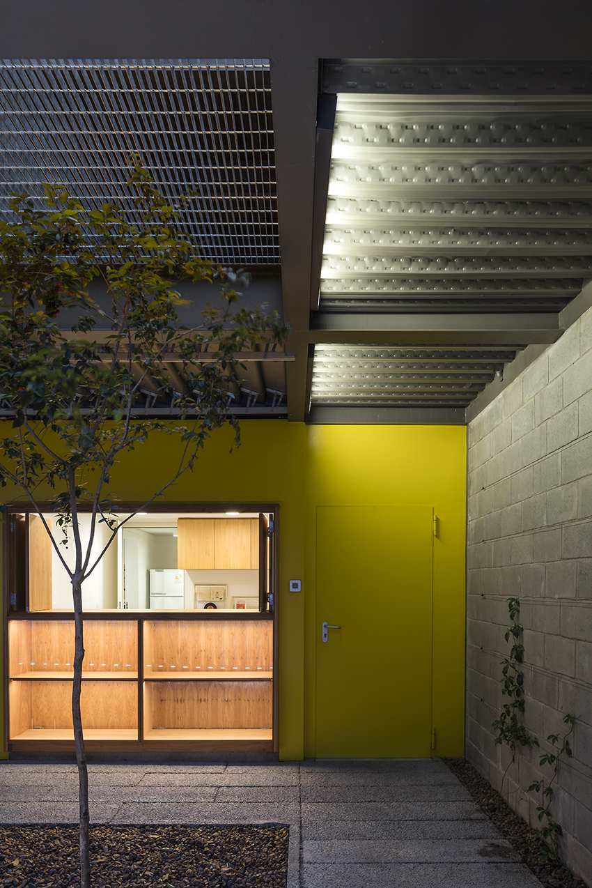 wooden cladding wraps the façade of brincante institute by bernardes arquitetura