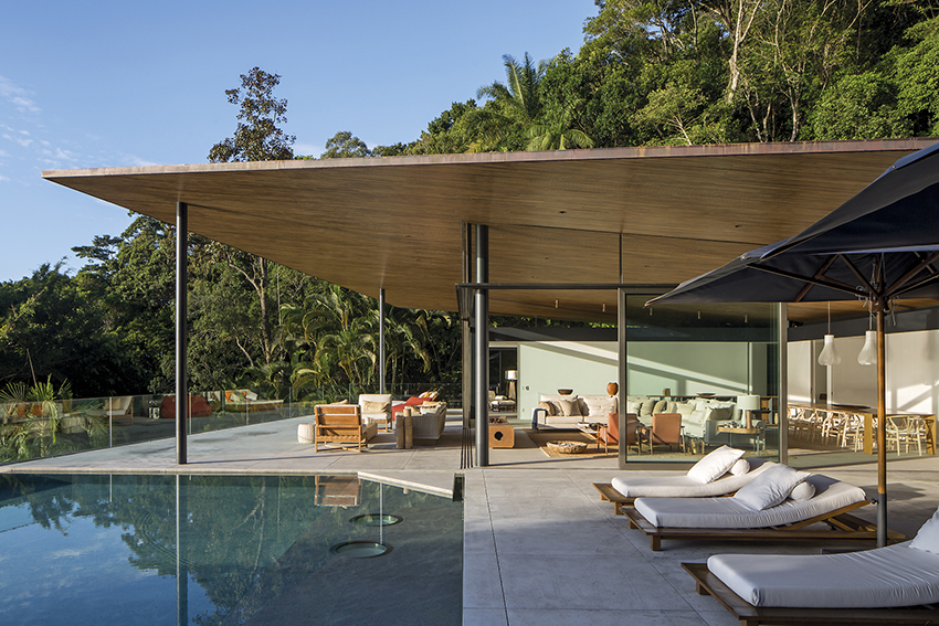 timber lattice with pivoting windows clads 'delta house' by bernardes arquitetura in brazil
