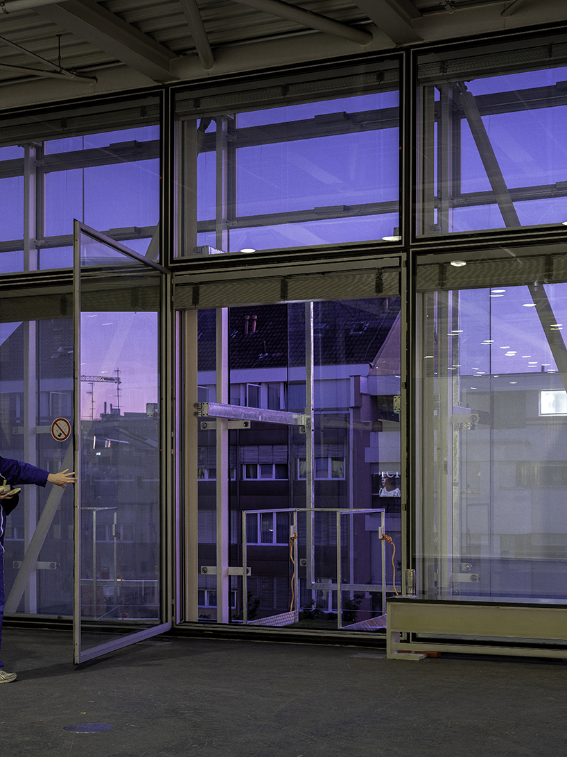 city and architecture are reconciled with installation by maciver-ek chevroulet that perforates messe basel façade