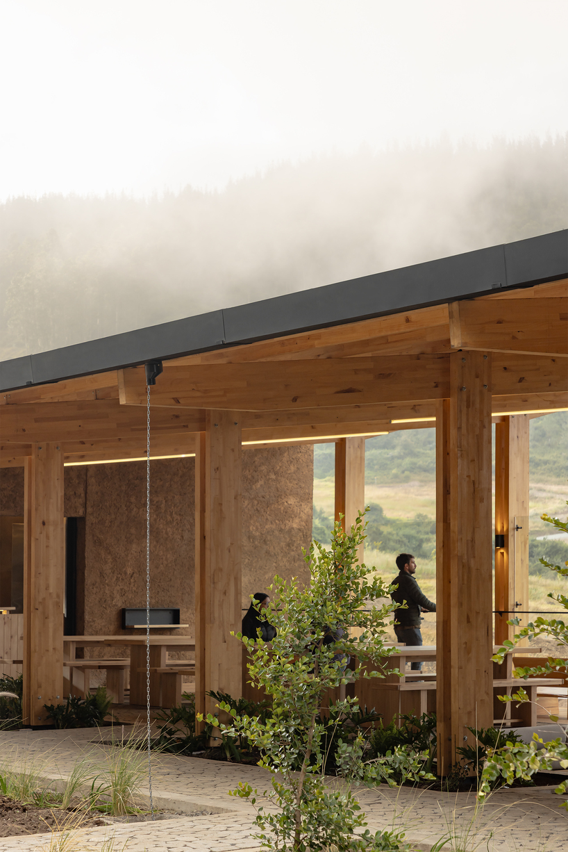 earth-toned concrete bike refuge emerges from ecuador’s reforested landscape - 5