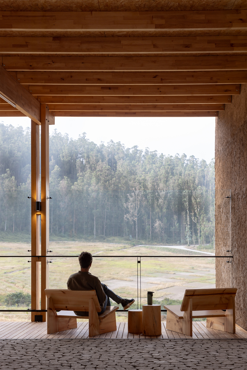 earth-toned concrete bike refuge emerges from ecuador’s reforested landscape - 6