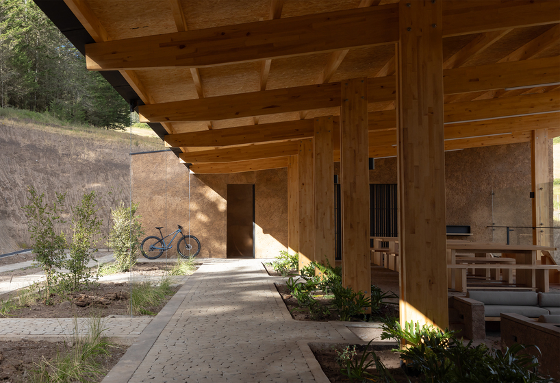 earth-toned concrete bike refuge emerges from ecuador’s reforested landscape - 8