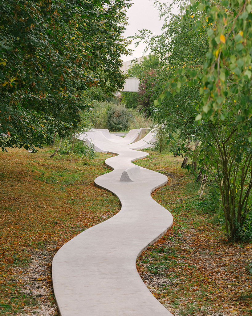 wavy concrete strips stretch along french industrial site to form 'skatepark continua'
