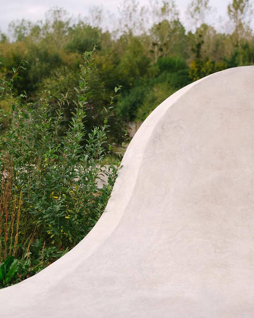 wavy concrete strips stretch along french industrial site to form 'skatepark continua'