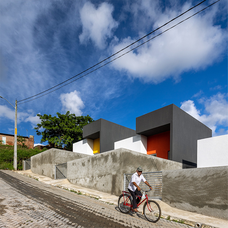 clean geometries and bright pops of color characterize social housing by NEBR arquitetura in brazil