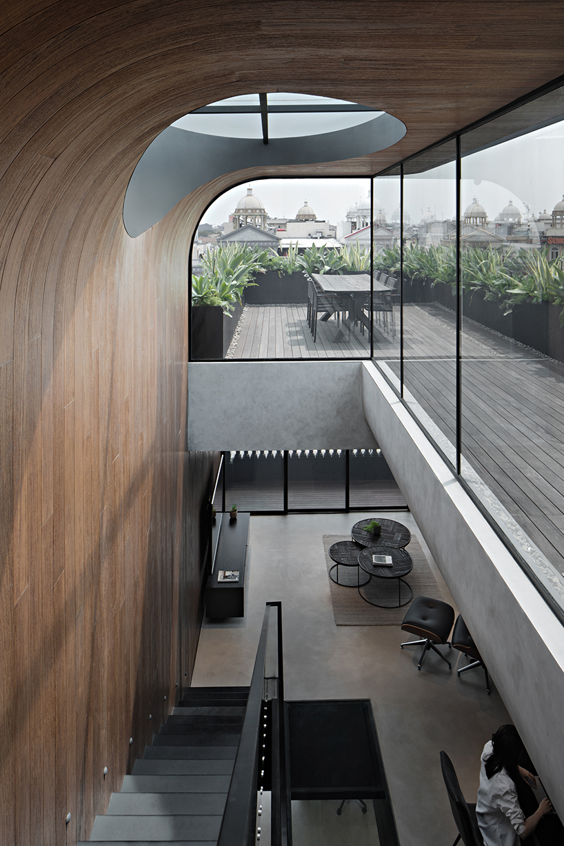 k thengono punctures holes from above to maintain well lit interior for a small tech start up office 4