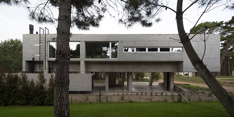 estudio galera rests monolithic home on concrete stilts to maximize space in argentina