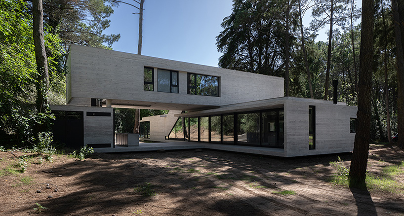 overlapping volumes of concrete and glass compose tucán house in buenos aires