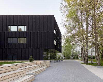 riga art and media school is a clapperboard inspired monochrome box in latvia