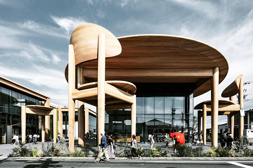 giant set of chairs and table shelters nikken sekkei's mixed-use 'sweets bank' in japan