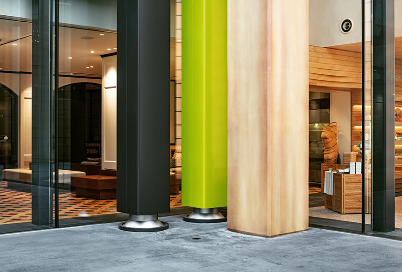 giant set of chairs and table shelters nikken sekkei's mixed-use 'sweets bank' in japan