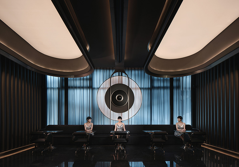 organic lights, mirrors & dark hues complete restaurant renovation by PIG design in hangzhou