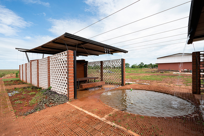 minimo común arquitectura tops office building in paraguay with 'smiling' floating roof