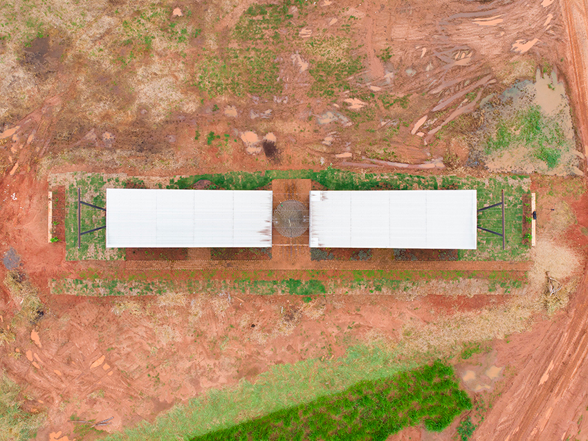 earth blocks and roof for water and wind catchment for a rural office in paraguay 7