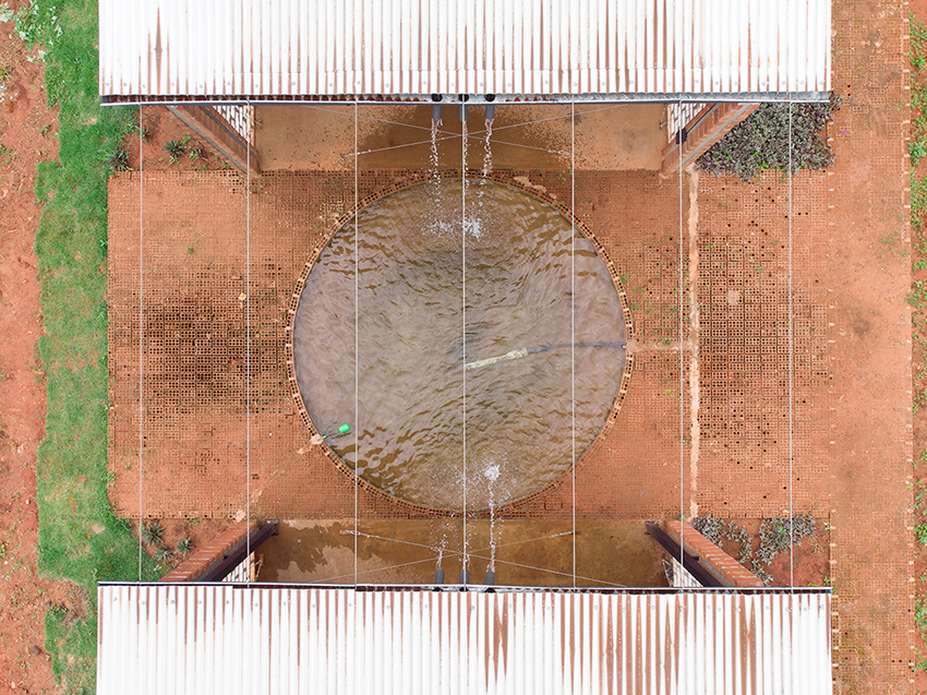 earth blocks and roof for water and wind catchment for a rural office in paraguay 8