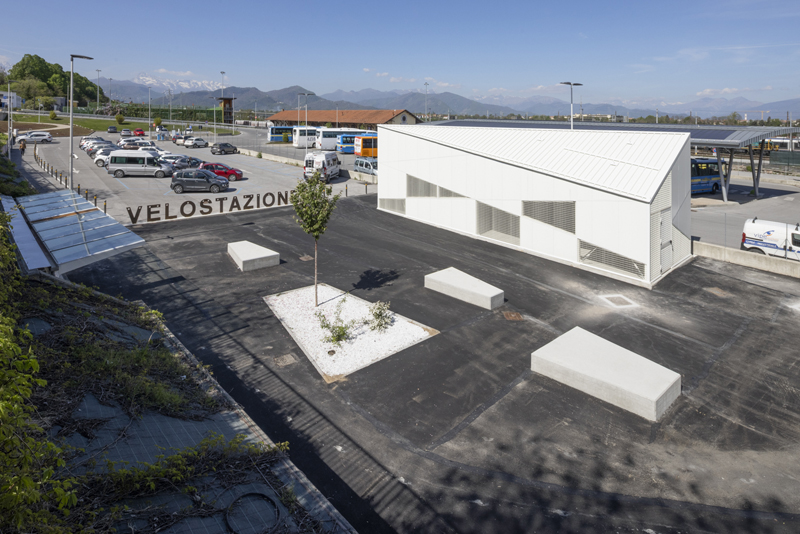 triangular geometries and gridded textures shape studio 3mark’s bike station in italy