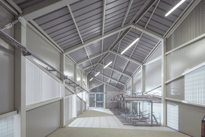 triangular geometries and gridded textures shape studio 3mark’s bike station in italy