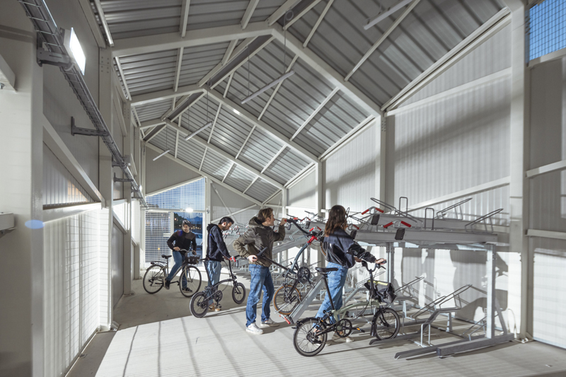 triangular geometries and gridded textures shape studio 3mark’s bike station in italy