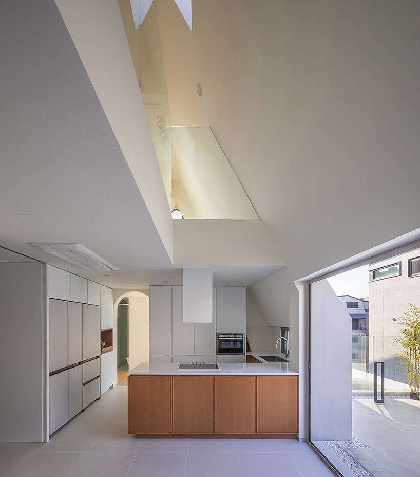 house-shaped volume in korea by rieuldorang atelier marks 'with home' corporate identity