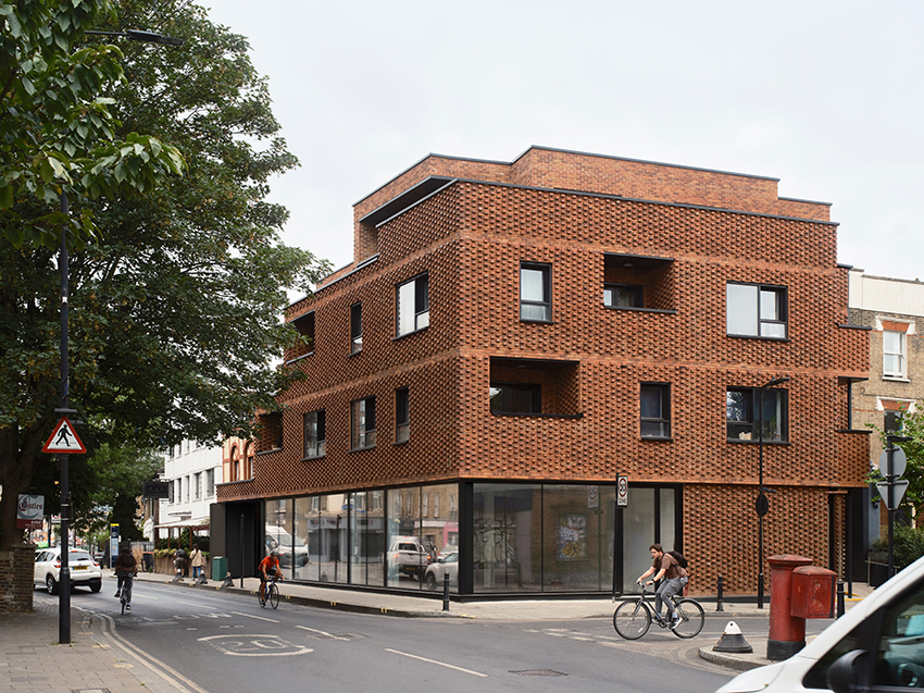 DROO covers residential unit's protruding volumes in textured brickwork in london