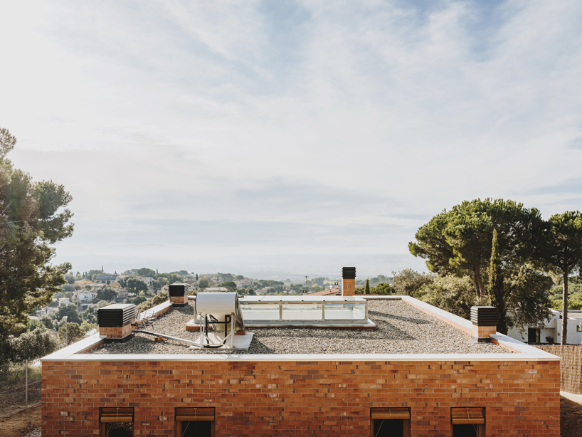 greenhouse-like patio punctures slow studio's passive house in ametlla
