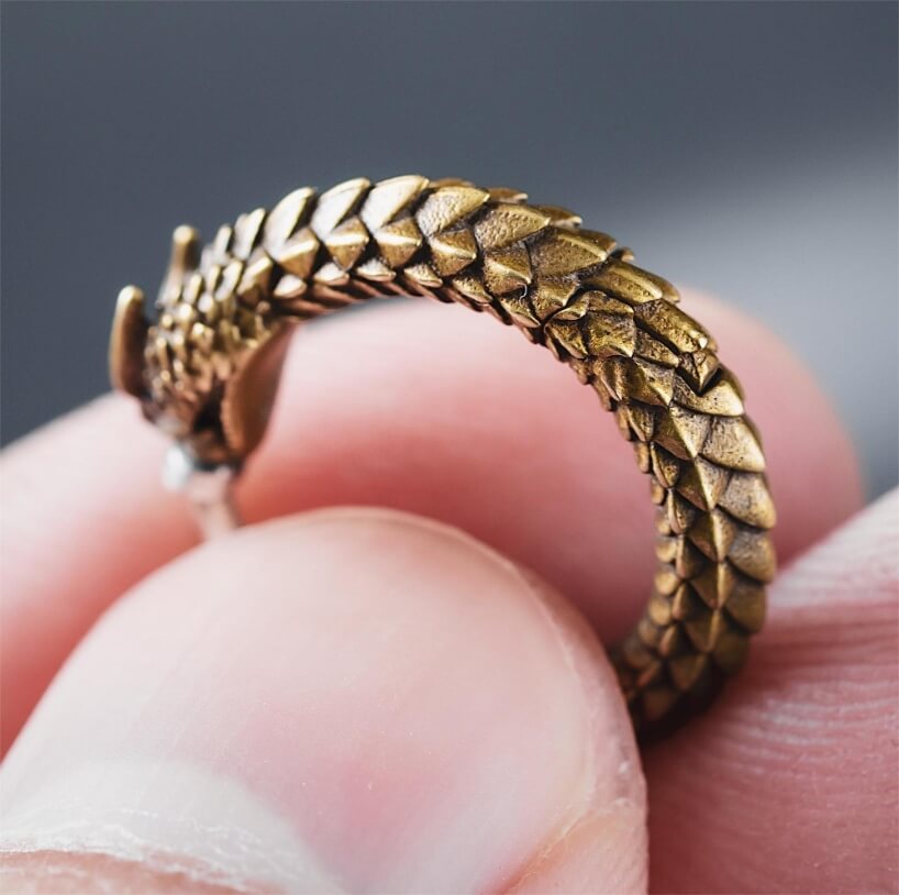 brass rattlesnake earrings by coppertist.wu capture ancient symbol of hope + eternity