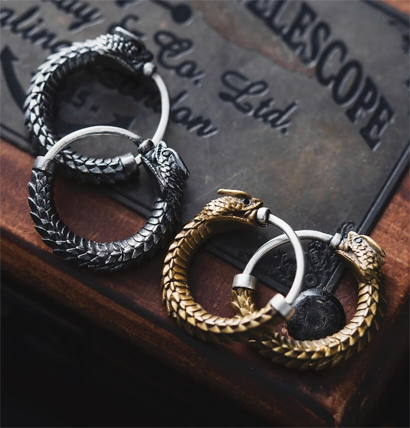 brass rattlesnake earrings by coppertist.wu capture ancient symbol of hope + eternity