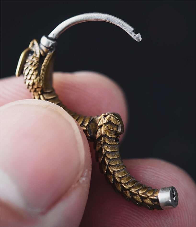 brass rattlesnake earrings by coppertist.wu capture ancient symbol of hope + eternity